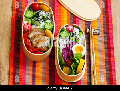 Japanese bento box with chicken, vegetables and rice Stock Photo
