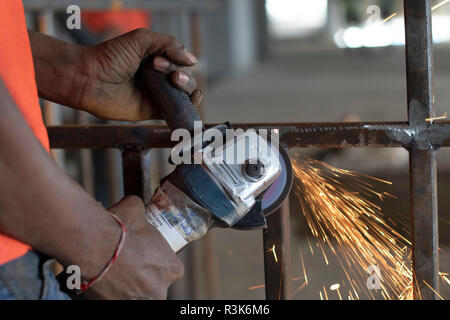 Person doing welding work, India. Stock Photo