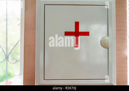 First-aid kit box hang on the wall Stock Photo