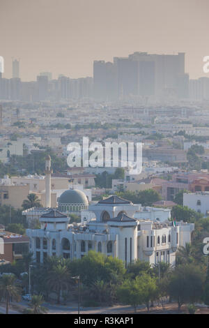 UAE, Abu Dhabi. Elevated skyline view with mosque over Baynunah Street Stock Photo