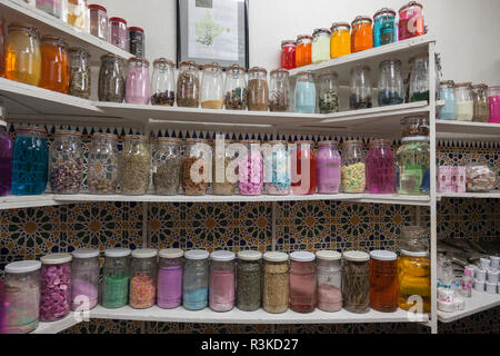 Bottles of natural medicines and plants line the shelves of a Berber traditional pharmacy in Marrakech, Morocco. Stock Photo