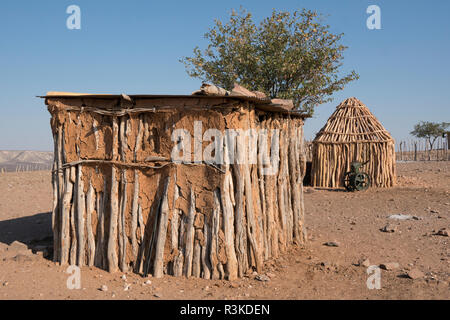 Traditional hut construction in a remote village outside of Opuwo, Namibia. Stock Photo
