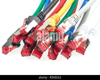 Ethernet patch cables with RJ45 connectors are used to route signals between various network devices Stock Photo