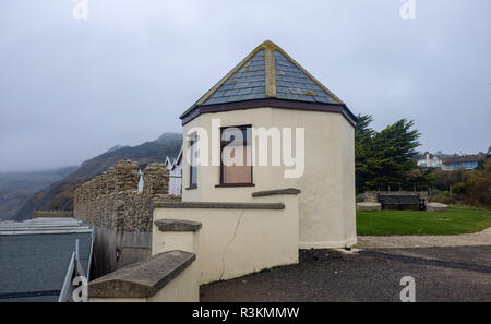 Grade 2 listed lookout building overlooking Jurassic coast beach between Charmouth and Lyme Regis in West Dorset built during the Napoleonic Wars in 1 Stock Photo