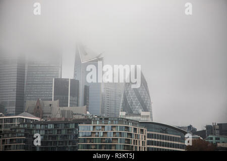 London UK. 23rd November 2018. The Cheesegrater and Gherkin buildings in the  London financial district covered in thick morning fog Credit: amer ghazzal/Alamy Live News Stock Photo