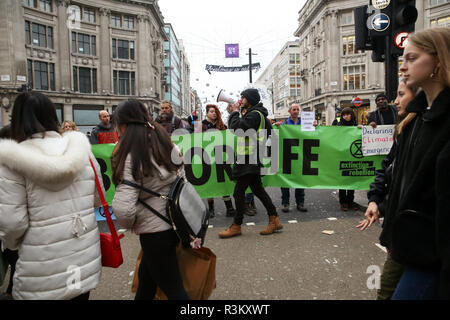 Oxford Street, London, UK 23 Nov 2018 - A group of Extinction Rebellion protesters block Oxford Street junction with Regent Street, holding the traffic on Black Friday Sales day.  Credit: Dinendra Haria/Alamy Live News Stock Photo