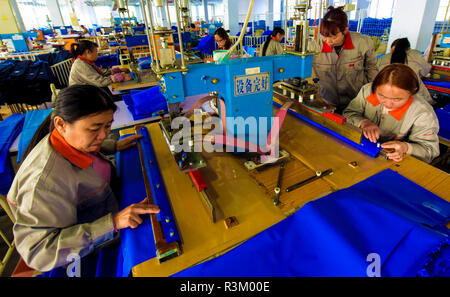 Hengshui, China's Hebei Province. 23rd Nov, 2018. Workers make medical equipment at a private enterprise in Jizhou District of Hengshui, north China's Hebei Province, Nov. 23, 2018. The district gave stronger support for private enterprises in recent years. There are more than 4,700 medical, composite material, and equipment manufacture private enterprises in Jizhou. Credit: Li Xiaoguo/Xinhua/Alamy Live News Stock Photo