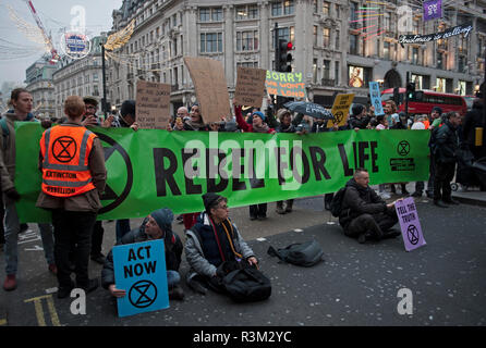 London, England 23rd November2018. Members of the environmental protest group Extinction Rebellion blocked roads on Oxford St, London to draw attention to the ongoing damage being caused to the environment.© Karl Nesh Credit: Karl Nesh/Alamy Live News Stock Photo