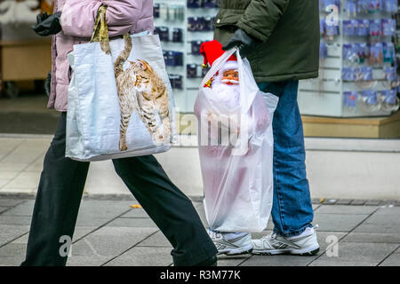 Southport, Merseyside, UK. 24th November, 2018. Black Friday Weekend Shoppers.  Town centre holiday shopping season, retail shops, stores, Christmas shoppers, discount sale shopping, female consumer spending on Black Friday weekend considered to be the biggest shopping event of the year.   U.K. retailers have embraced the USA style sale bonanza, with many customers left surprised by bargain discounts, enjoying a Xmas spend & carrying a cat bags, father christmas gifts, presents and sale items. Credit: MediaWorldImages/Ģ����ýLiveNews. Stock Photo