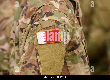 Bahrain flag on soldiers arm (collage). Stock Photo