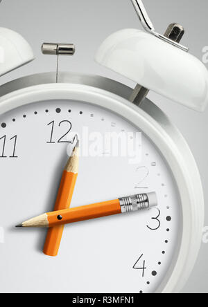 Time concept, clock with pencil clock hand, close-up Stock Photo
