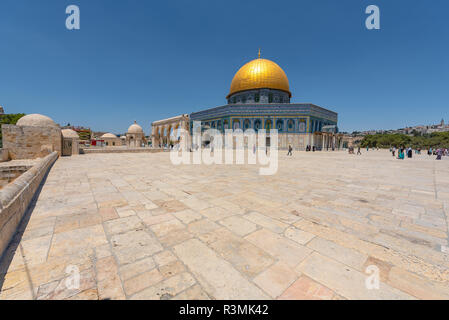 People exploring the Dome of the Rock. It is an Islamic shrine located on the Temple Mount in the Old City of Jerusalem. Stock Photo