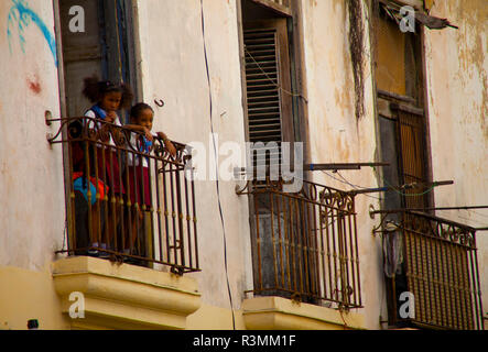 Havana, Cuba. Children standing on balcony Stock Photo