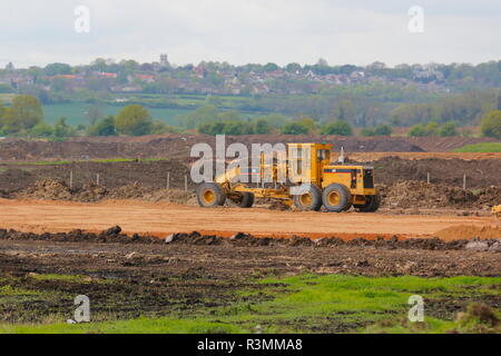 A Caterpillar motor grader used for levelling off road surfaces and maintenance of haul roads on the construction of IPORT,Doncaster. Stock Photo
