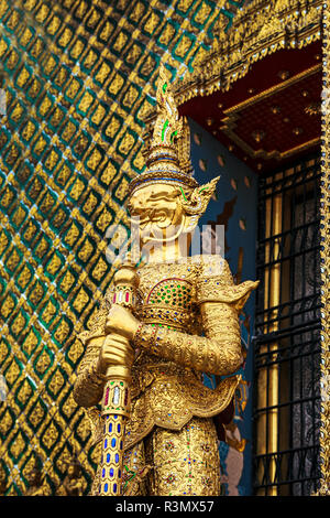 Bangkok, Thailand. Wat Phra Kaeo Grand Palace (Temple of the Emerald Buddha), A Golden Demon (Dschaks) standing guard outside Stock Photo