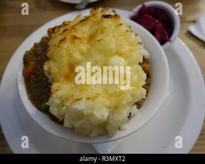 sheperds pie / cottage pie photo with cheesy mash and red cabbage Stock Photo