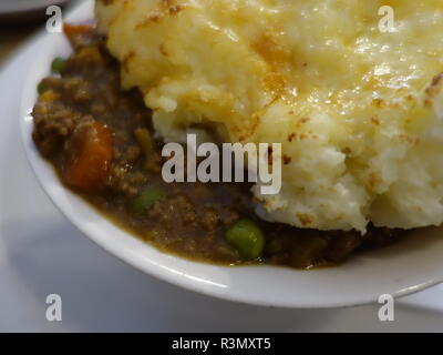 sheperds pie / cottage pie photo with cheesy mash and red cabbage Stock Photo