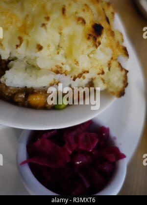 sheperds pie / cottage pie photo with cheesy mash and red cabbage Stock Photo