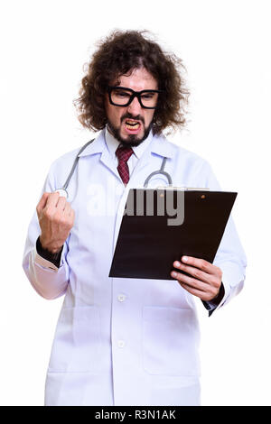 Studio shot of angry man doctor reading on clipboard with fist r Stock Photo