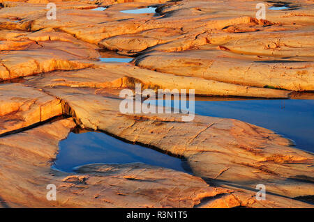 Canada, Ontario, Killarney Provincial Park. Rocks of precambrian shield at sunrise. Stock Photo