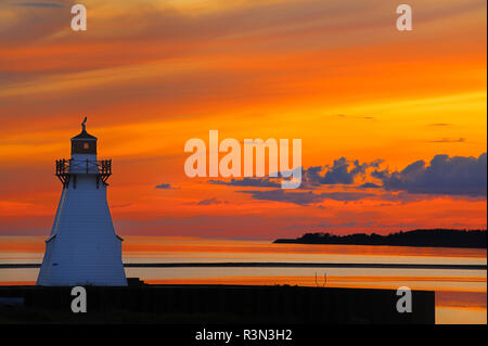 Canada, Prince Edward Island, Wood Islands. Lighthouse at sunset. Stock Photo