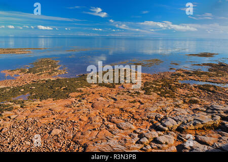 Canada, Prince Edward Island, Point Prim. Rocky coastline along Northumberland Strait. Stock Photo