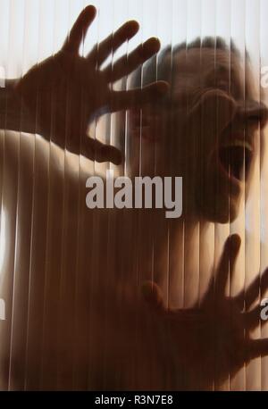 aggressive man behind a disc - horrorbild Stock Photo - Alamy
