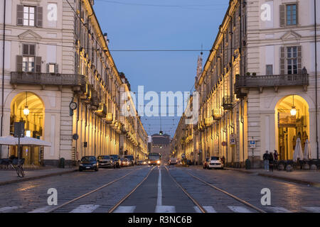 Street scene in Turin, Italy with zebra crossing in foreground. Photographed early in the morning. Stock Photo