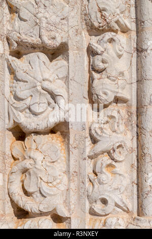 Closeup detail of sculpured rock, portal in Manueline style of church of Alvor, Algarve, Manueline style. Stock Photo