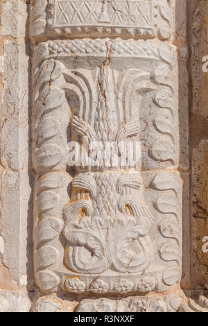 Closeup detail of sculpured rock, portal in Manueline style of church of Alvor, Algarve, Manueline style. Stock Photo