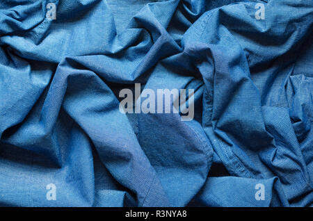 Wrinkled texture of blue fabric for shirts. Blank textile background Stock Photo