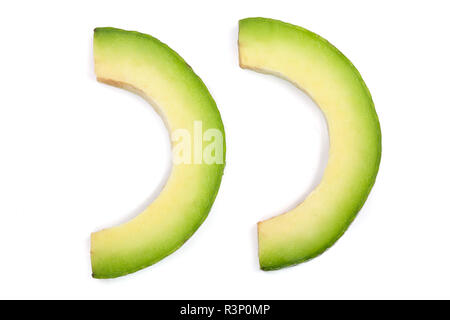 avocado slices isolated on white background. Top view. Flat lay pattern Stock Photo