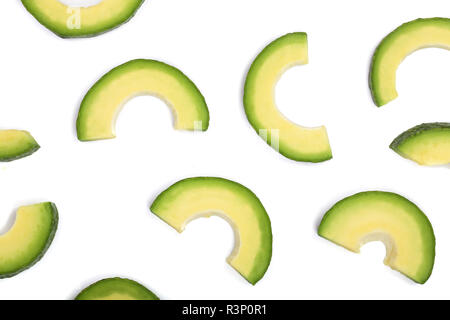 avocado slices isolated on white background. Top view. Flat lay pattern Stock Photo