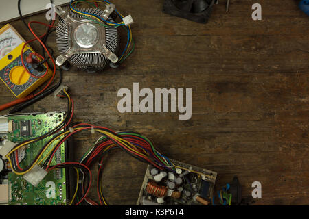 Circuit board and multimeter on table Stock Photo