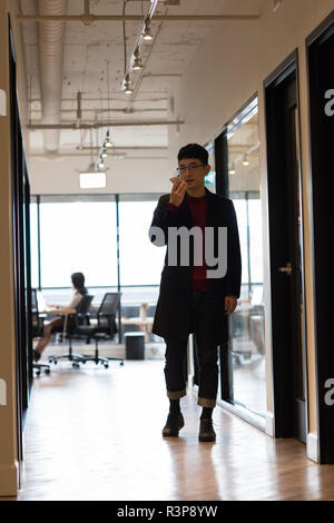 Executive talking on mobile phone Stock Photo