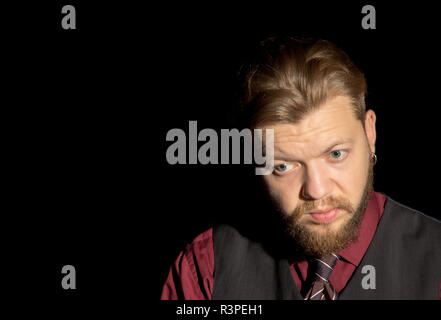 image of a man with a beard on a black background Stock Photo