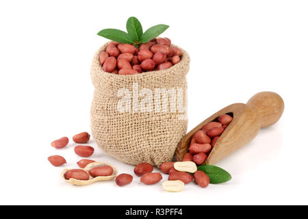 peanuts with leaf in bag isolated on white background Stock Photo