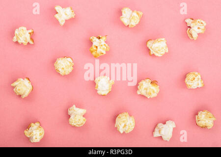 Popcorn on red background. Top view. Flat lay pattern Stock Photo
