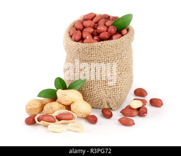 peanuts with leaf in bag isolated on white background Stock Photo