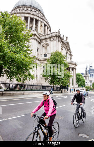 City of London England,UK Ludgate Hill,St Paul's Cathedral,mother church,Anglican,religion,historic,Grade I listed,dome,exterior,cyclist,bicycles,man Stock Photo