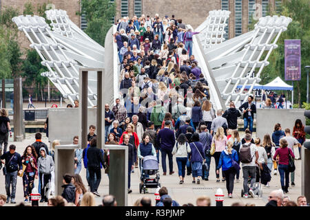 London England,UK,Millennium Bridge,steel suspension,footbridge,pedestrian crossing Thames River,crowded,multi ethnic multiethnic,man men male,woman f