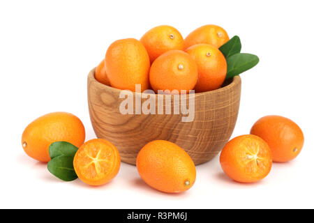 Cumquat or kumquat with leaf in wooden bowl isolated on white background close up Stock Photo