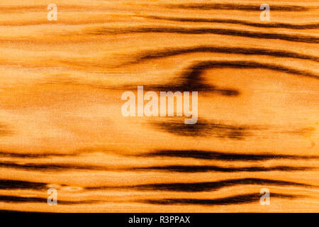 Background texture from burned brown pine wood. Stock Photo