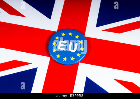 London, UK - November 20th 2018: An EU pin badge, pictured over the flag of the United Kingdom. Stock Photo