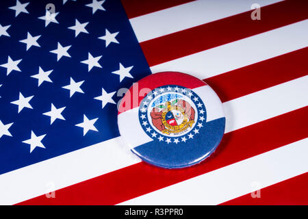 London, UK - November 20th 2018: The symbol of the State of Missouri, pictured over the flag of the United States of America. Stock Photo
