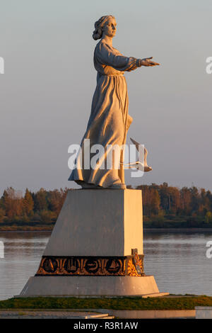 The statue Mother Volga, with hand outstreched in welcome, in the Rybinsk reservoir on the Volga River. Stock Photo