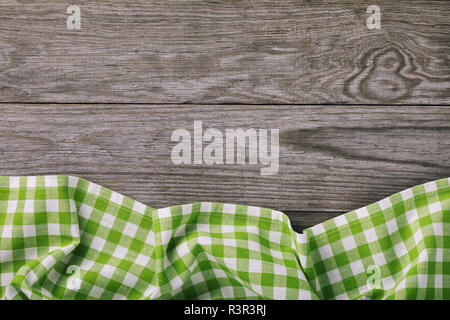 Top view on multi-colored napkin from bottom side of a wooden table. Food background Stock Photo