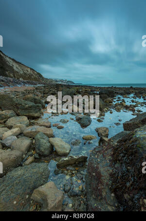 ventnor isle of wight coastline with atmospheric beach and coastal rugged rocky foreshore on shoreline. isle of wight shore. Stock Photo