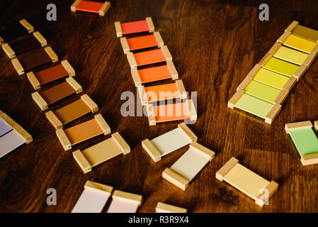 Montessori color tablets on wooden floor background Stock Photo