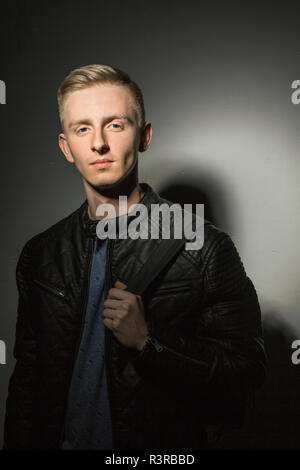 Portrait of young man wearing black leather jacket Stock Photo